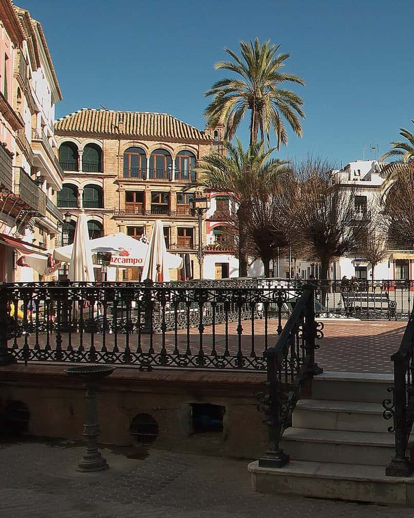 Plaza de San Fernando in Carmona's old town, with whitewashed facades and orange trees around it