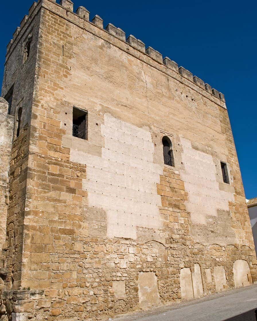 Alcázar de la Puerta de Sevilla in Carmona, a stone wall with its archway into the old town