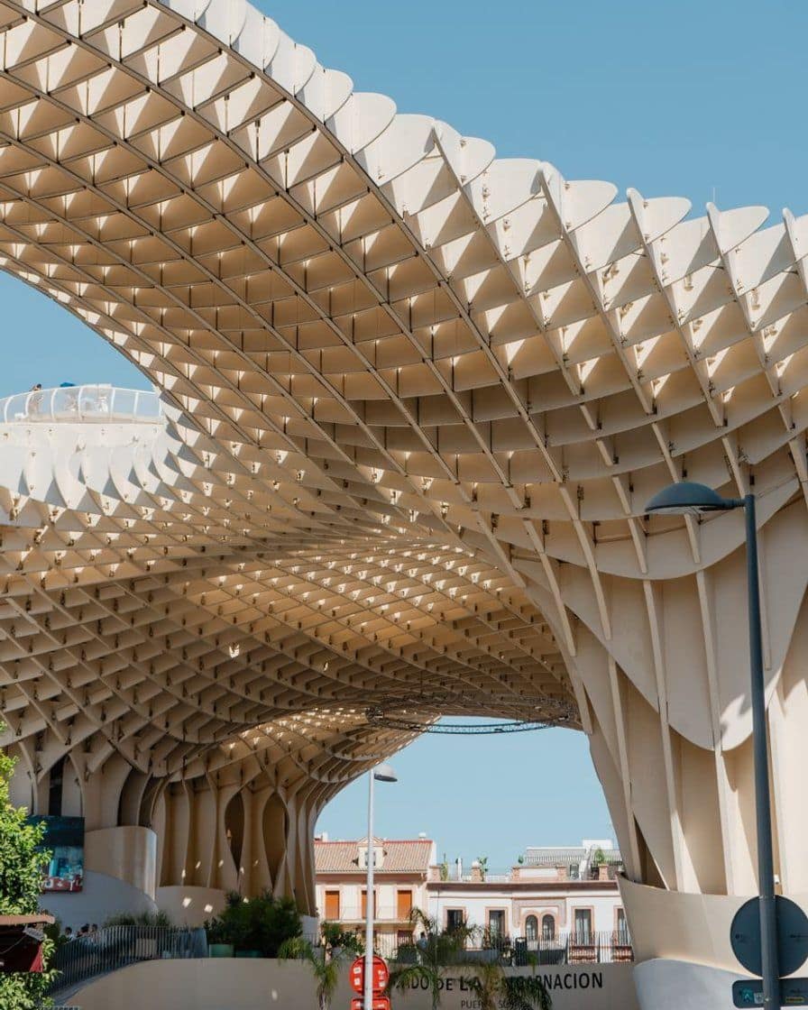 Platform of a Seville metro line 1 station at night, with passengers waiting for the train during Holy Week